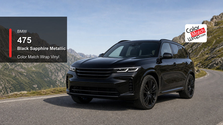 Black SUV on an alpine mountain road with BMW 475 Black Sapphire Metallic Color Match Wrap graphic