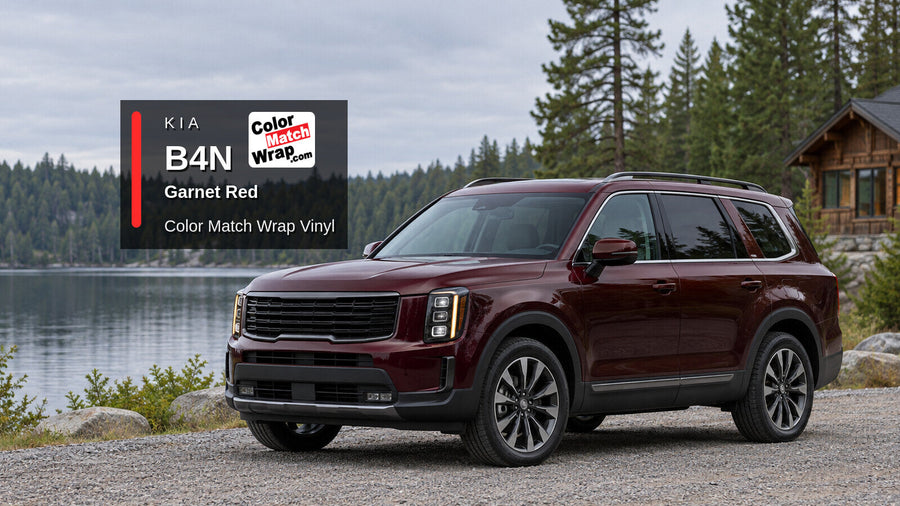Illustrative three-row SUV in Kia B4N Garnet Red with Color Match Wrap branding