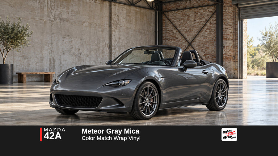 Illustrative MX-5 Miata-inspired roadster in Mazda 42A Meteor Gray Mica with Color Match Wrap branding