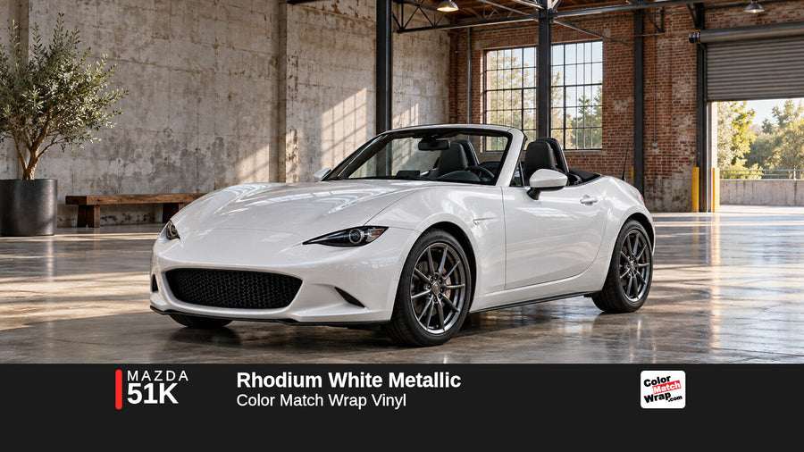 Illustrative MX-5 Miata-inspired roadster in Mazda 51K Rhodium White Metallic with Color Match Wrap branding