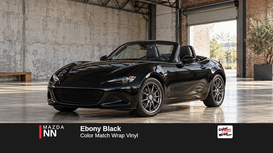 Illustrative MX-5 Miata-inspired roadster in Mazda NN Ebony Black with Color Match Wrap branding